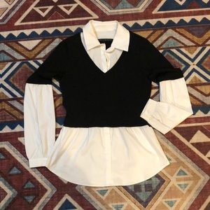 Crisp white button up with connected black sweater